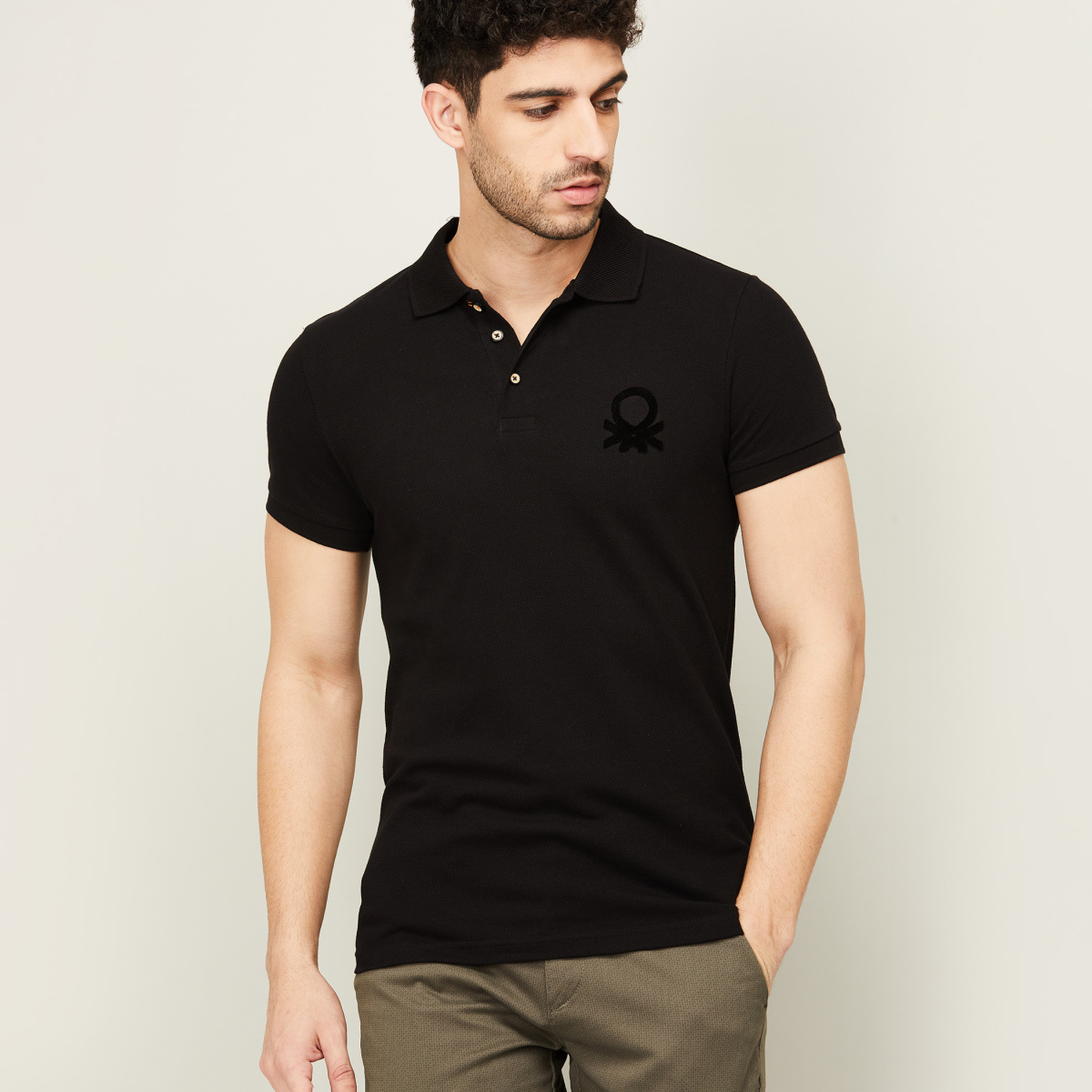 UNITED COLORS OF BENETTON Men Solid Polo T-shirt | Lifestyle Stores ...